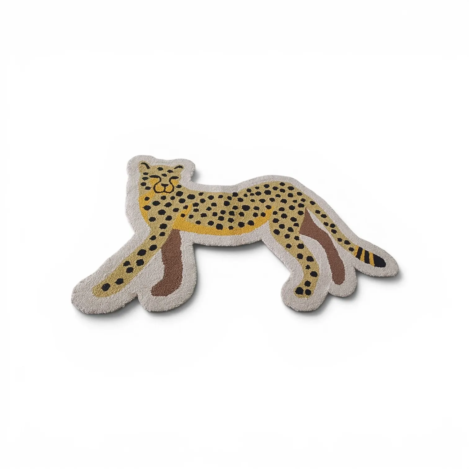 A cheetah-shaped rug in mustard with black spots and a cream border, on a white background