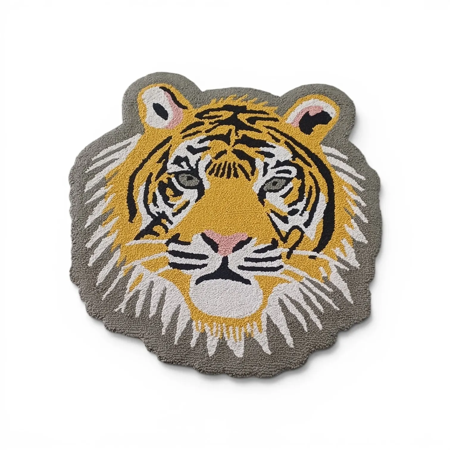 A round tiger-face rug in yellow, black and white with a grey mane border, on a white background
